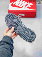Underside of the dark navy sneaker showing its patterned outsole