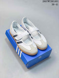Pair of white adidas Samba Jane sneakers with grey stripes, Mary Jane straps and gum-colored soles