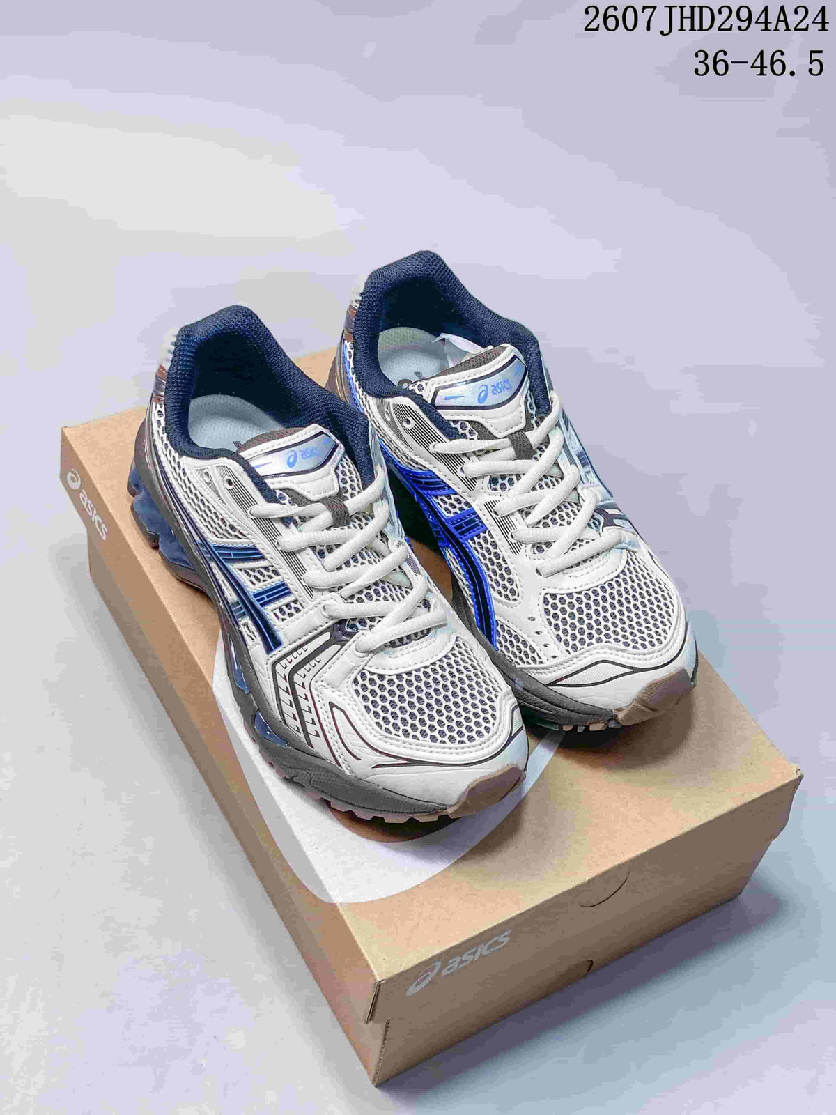 Pair of ASICS Gel-Kayano 14 sneakers in white, blue, gray, and metallic bronze on an ASICS shoebox; image shows style code 2607JHD294A24 and size range 36–46.5.