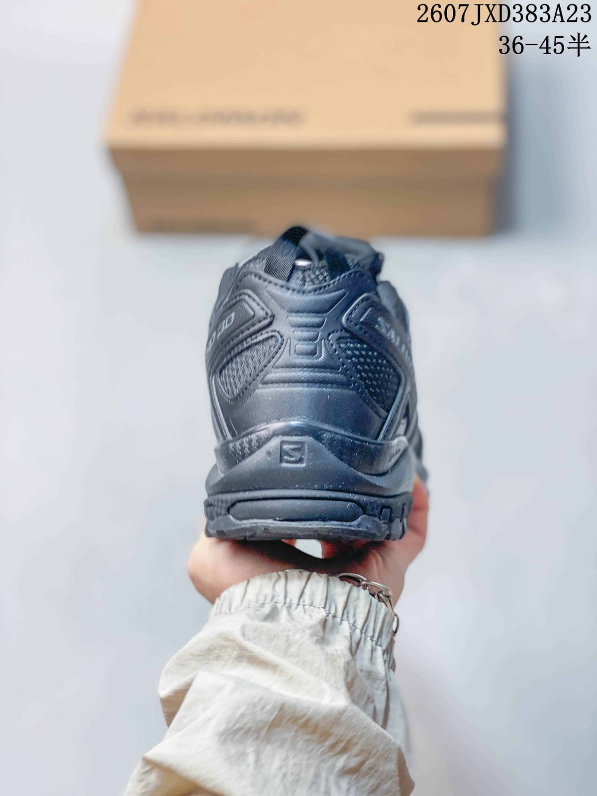 Rear view of the gray sneaker showing the structured heel, heel pull tab, and XA PRO 3D branding.