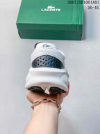 Rear view showing the white heel, navy heel detail, and crocodile emblem