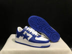 Angled view of the sneakers with one shoe lifted to show the blue textured outsole and star tread pattern.