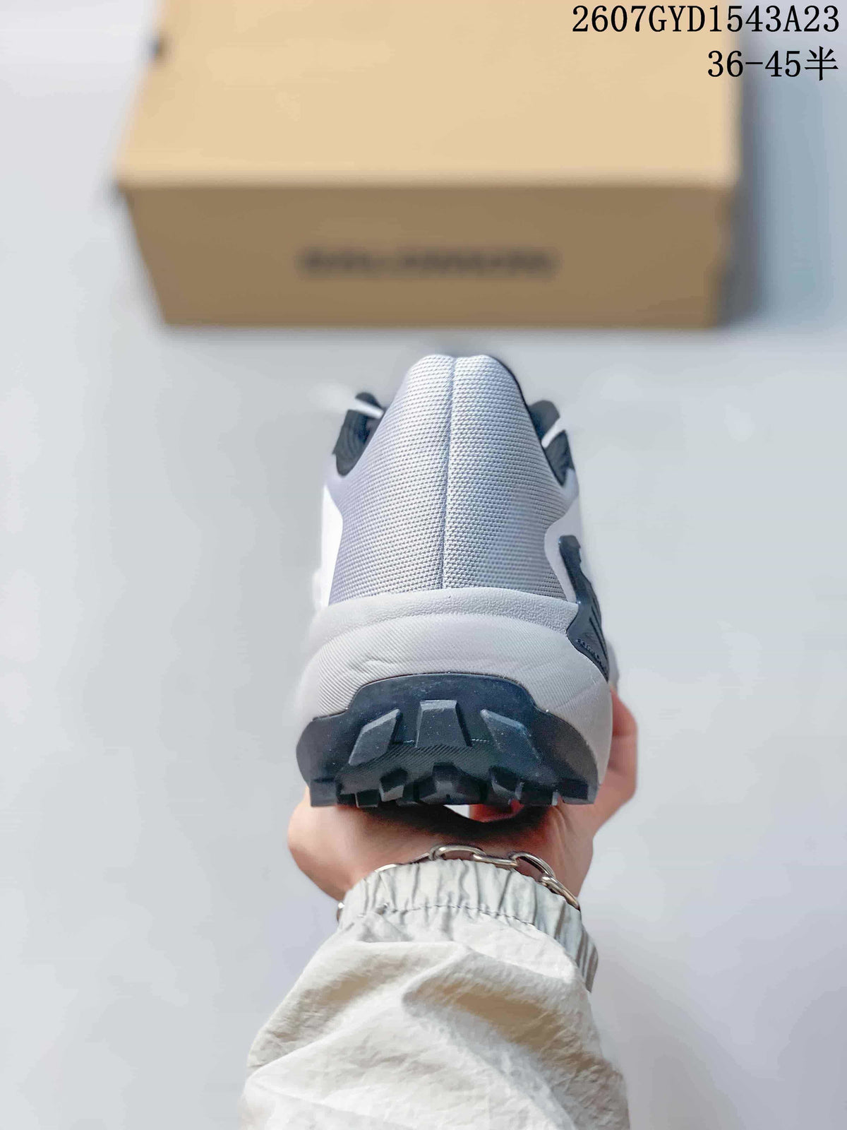 Rear view of the shoe showing the padded-looking heel area and raised outsole lugs.