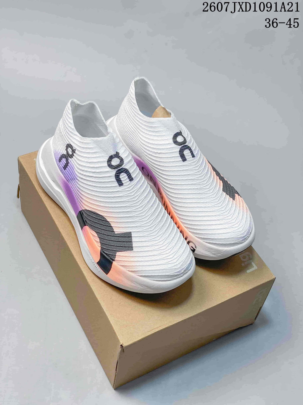 Pair of white On slip-on running shoes with purple, peach, and black accents displayed on a shoebox; image text shows 2607JXD1091A21 and 36–45.