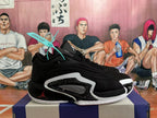 Side view of a black Jordan basketball shoe with white and red details