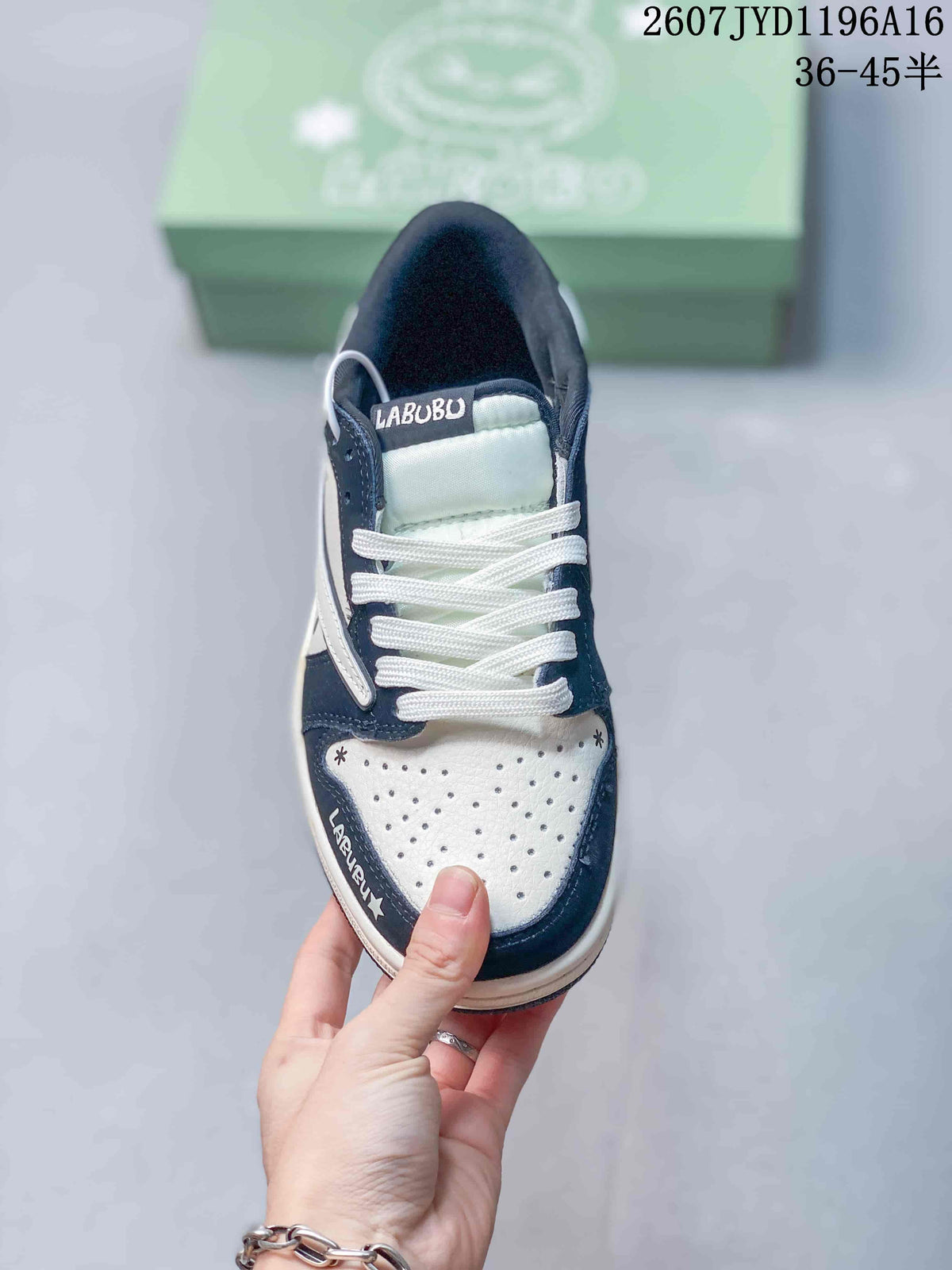 Top view showing white laces, a perforated white toe box, dark navy trim, and Labubu branding.