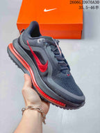 Dark gray Nike Air Zoom Pegasus Premium sneaker with red accents and a visible midsole unit.
