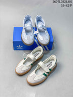 Pale blue and white-and-green Samba Jane sneakers shown together.