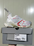 Puma 9260 Runner 2 sneaker in white, beige, and red shown on its shoebox, with the box label visible.