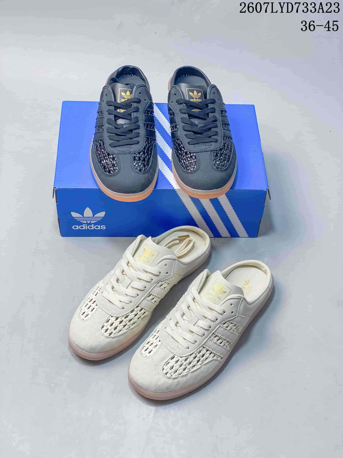 Black and off-white adidas Samba OG mule-style sneakers arranged with their blue shoeboxes, showing the open-back design.