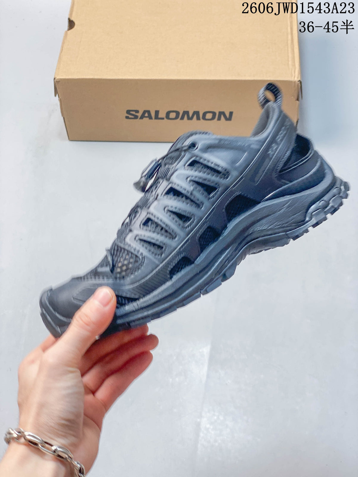 Side profile of the dark gray low-top outdoor shoe