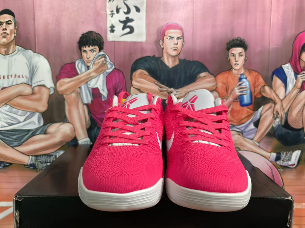 Front view of pink Nike Kobe basketball shoes with matching laces and white soles