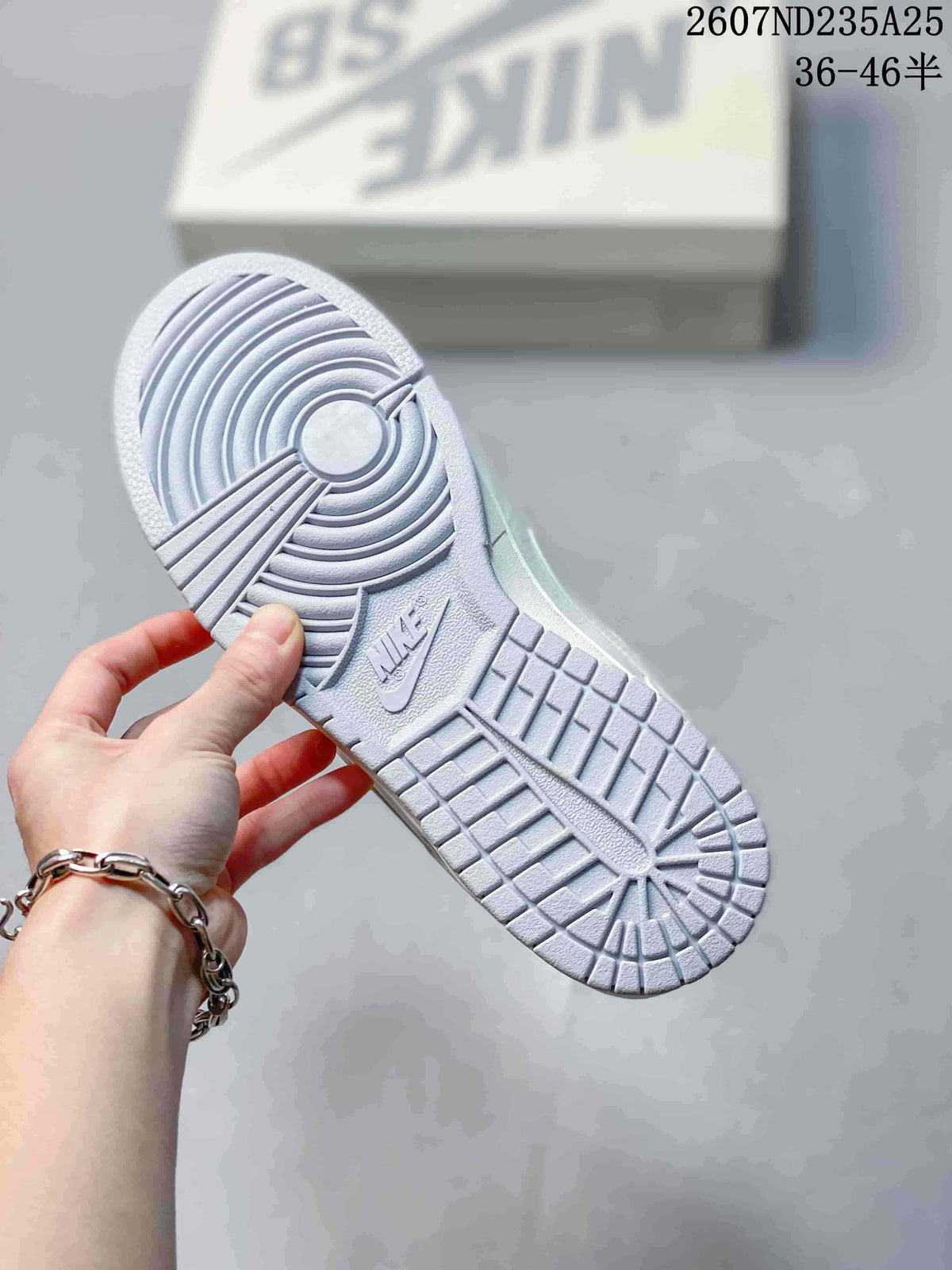 Close-up of the textured outsole showing circular and linear traction patterns.