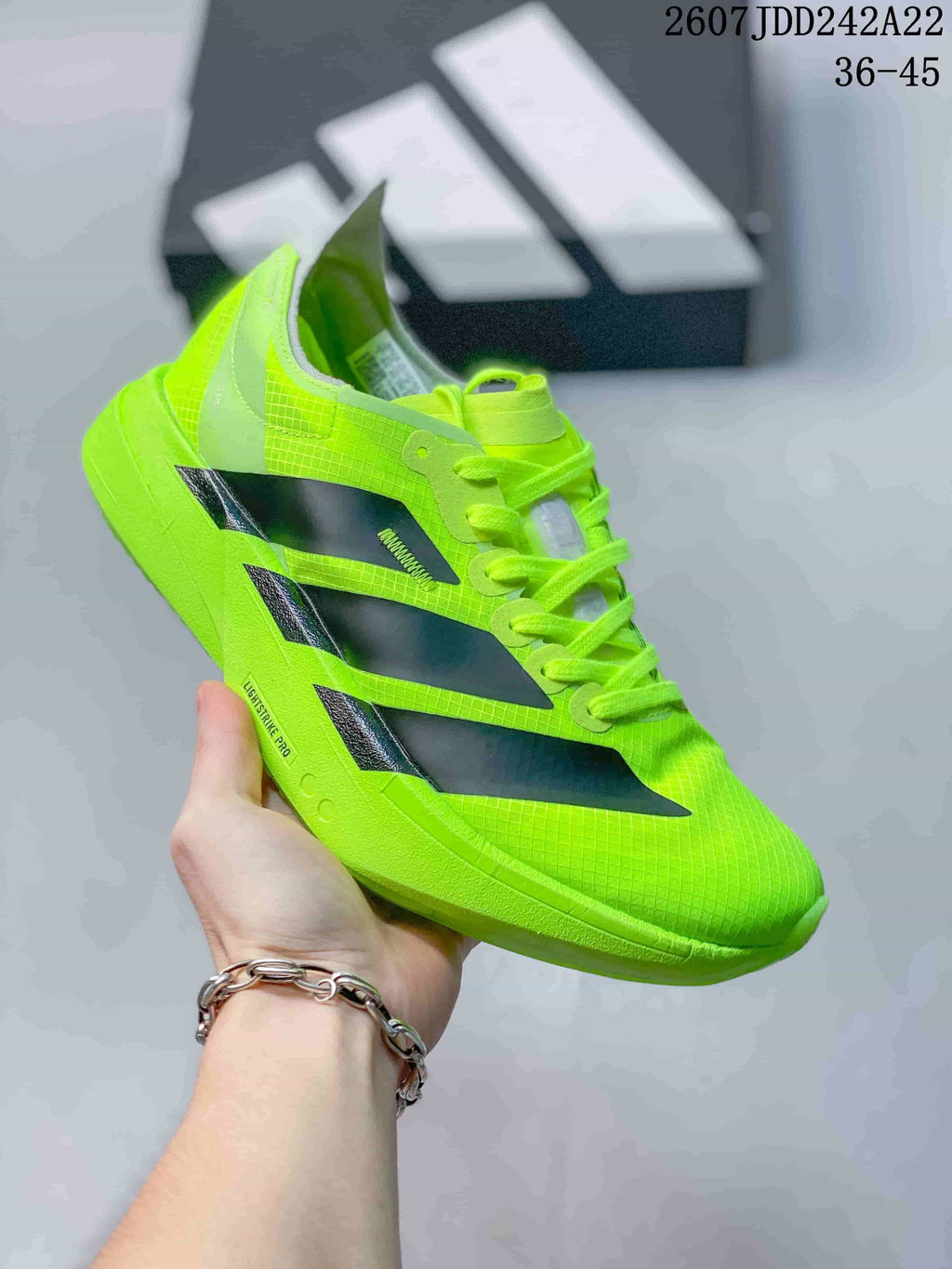 Neon green Y-3 Adios Pro 4 sneaker with black side overlays; image text shows JDD242A22 and sizes 36–45.