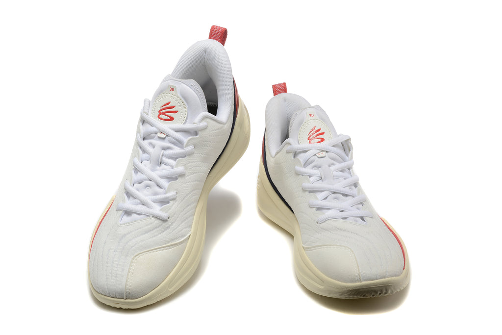 Pair of white Nike LeBron basketball shoes with red accents, shown from the front