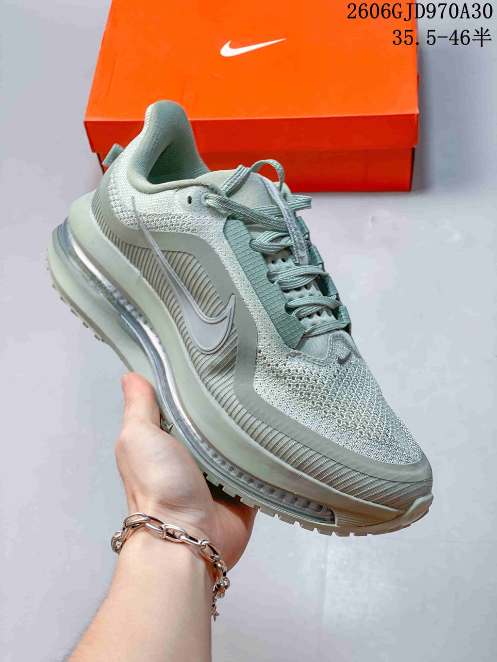 Angled side view of a sage-green Nike Pegasus Premium shoe