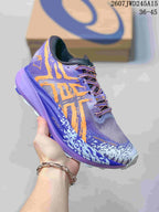 Close-up of a purple and orange ASICS sneaker with patterned upper, purple midsole and contrasting laces.