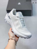 Angled side view of the white KAILAS VENTO shoe showing the upper, lace toggle and rugged outsole.