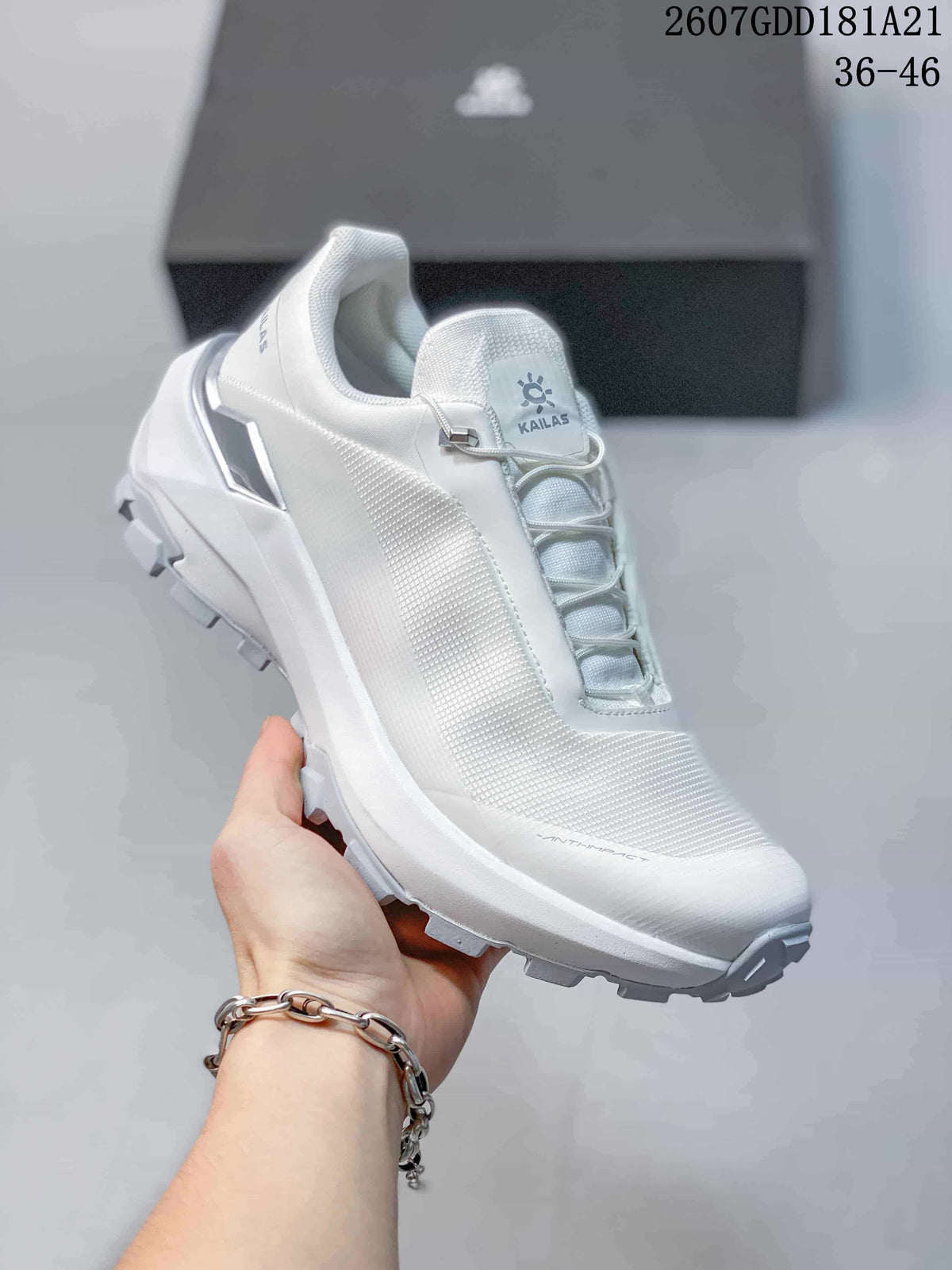 Angled side view of the white KAILAS VENTO shoe showing the upper, lace toggle and rugged outsole.