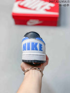 Rear view showing blue Nike branding on the white heel and the black outsole edge.