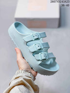 Light blue Papillio three-strap sandal with matching buckles and a textured outsole.