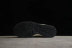Bottom view showing the black rubber outsole with circular and block-pattern traction.