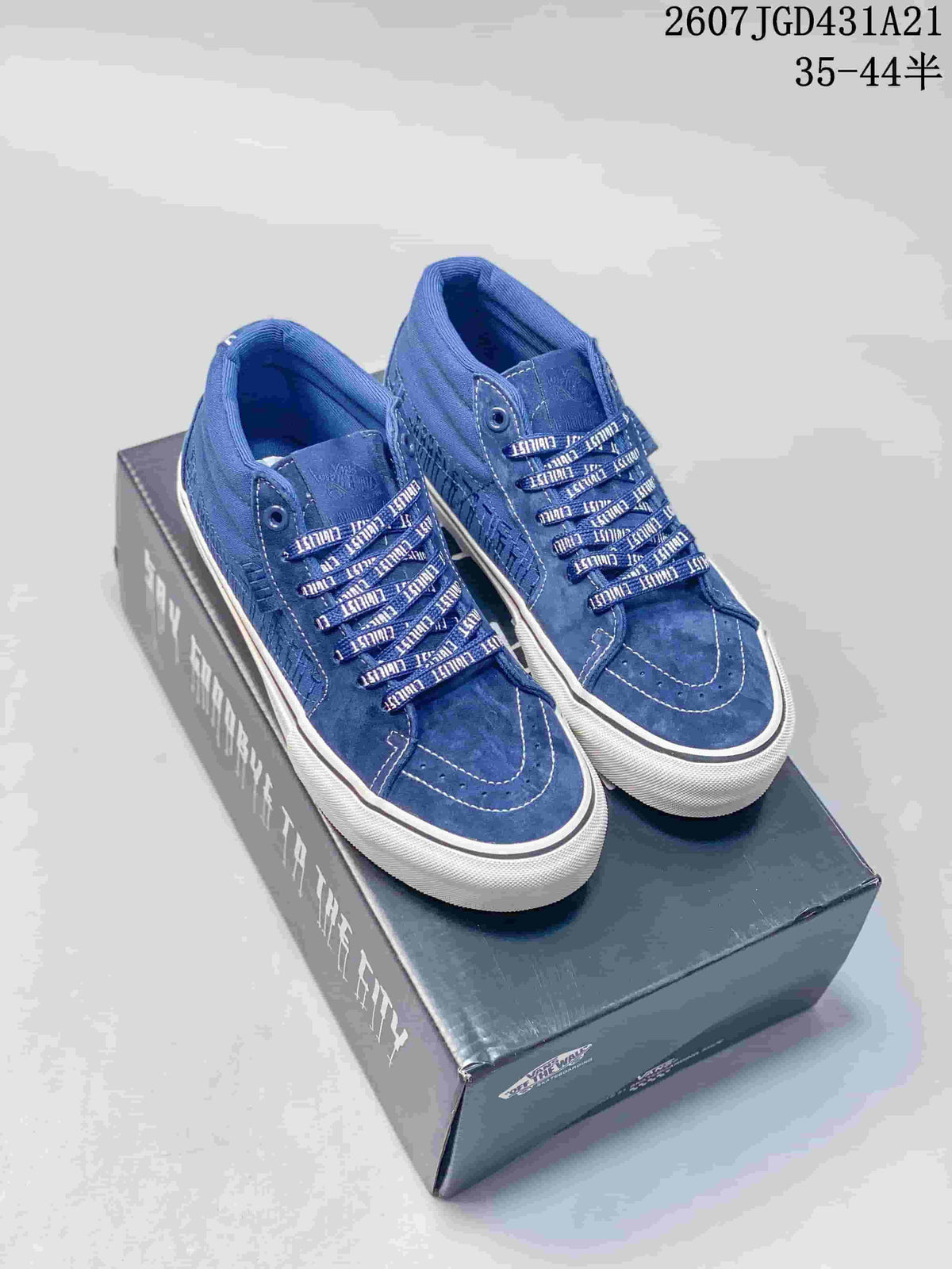 Pair of blue Vans CIVILIST BERLIN x SK8 sneakers displayed on a branded shoebox, with patterned laces and white soles.