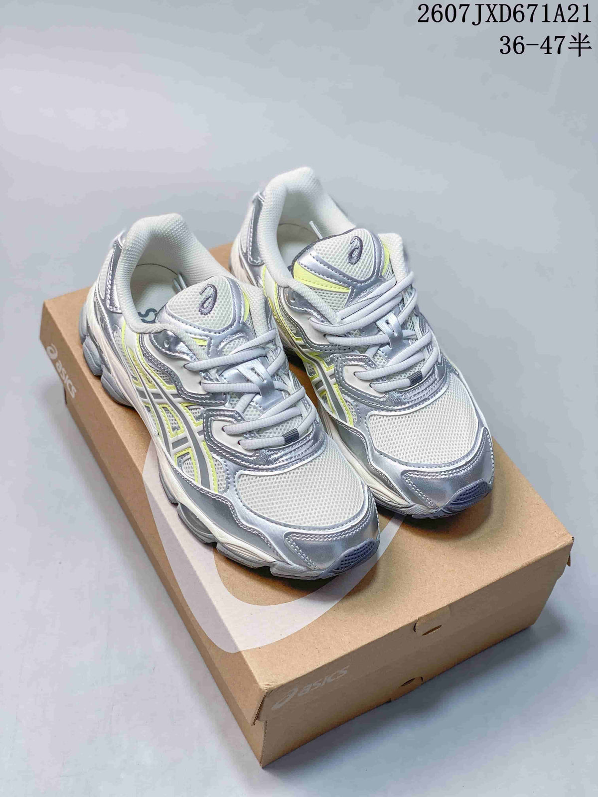 Pair of silver, white, and lime ASICS GEL-KAYANO 14 sneakers displayed on a shoebox.