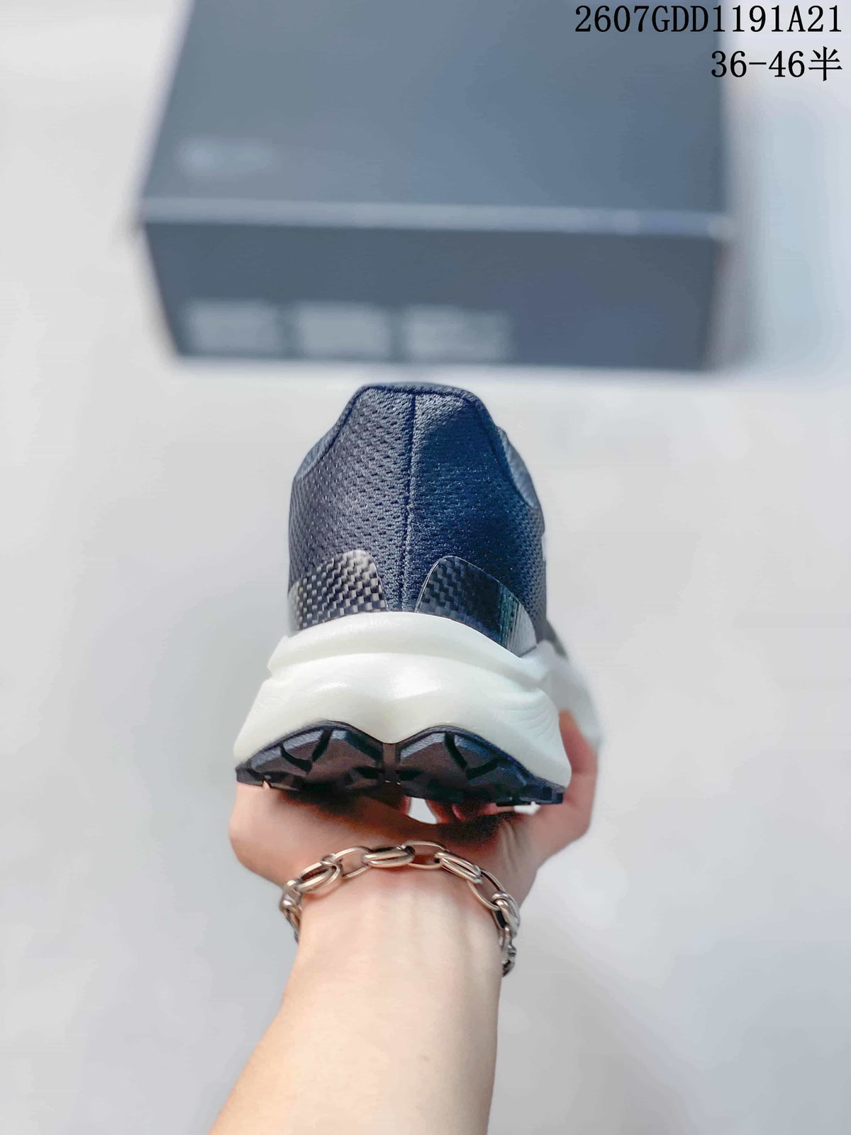 Rear view of the sneaker showing the mesh heel, white midsole, and dark outsole lugs.