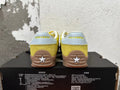 Rear view of yellow Converse training-style shoes with light-colored heel panels and gum-colored soles.