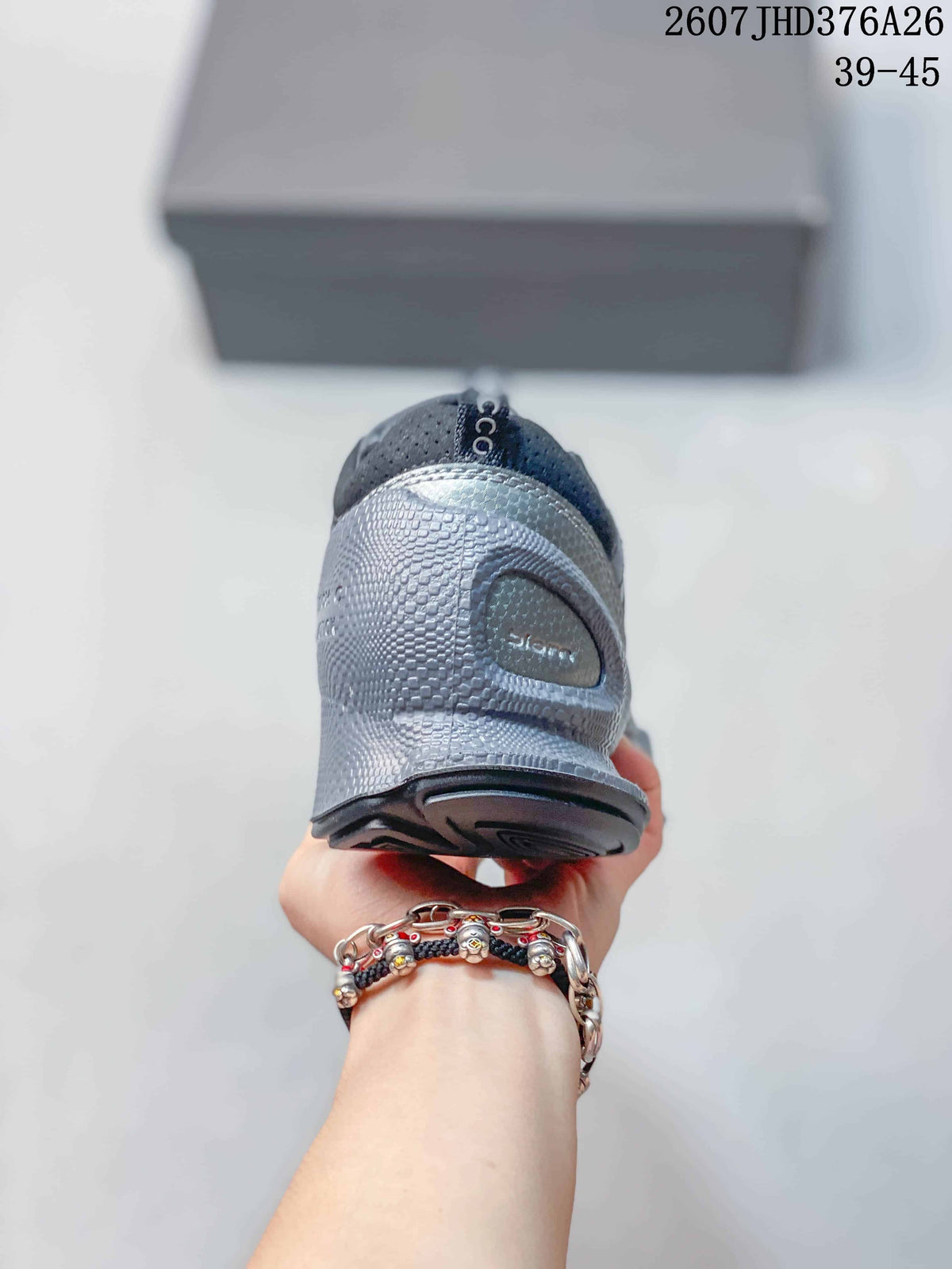 Rear view of the black and gray sneaker showing the textured heel and outsole.