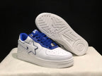 Angled view of a white and blue sneaker with the second shoe lifted to reveal the patterned rubber outsole.