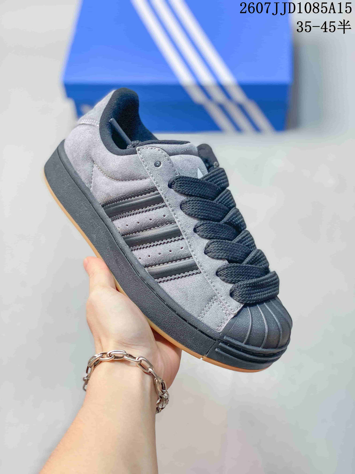 Angled side view highlighting the shell toe, black side stripes and layered sole.