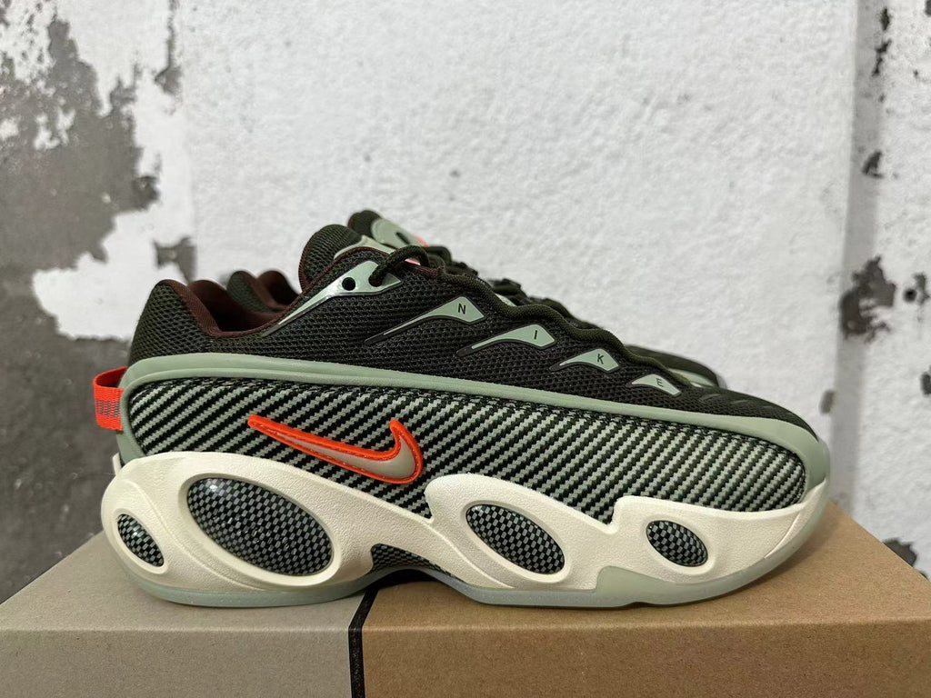 Side view showing a patterned panel, orange Nike swoosh, and sculpted cream-colored sole.