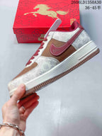 Side view of the low-top sneaker with brown and cream panels and a red Swoosh