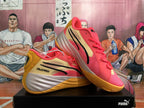 PUMA All-Pro basketball shoes displayed from the side and front in a coral pink and gold colorway.