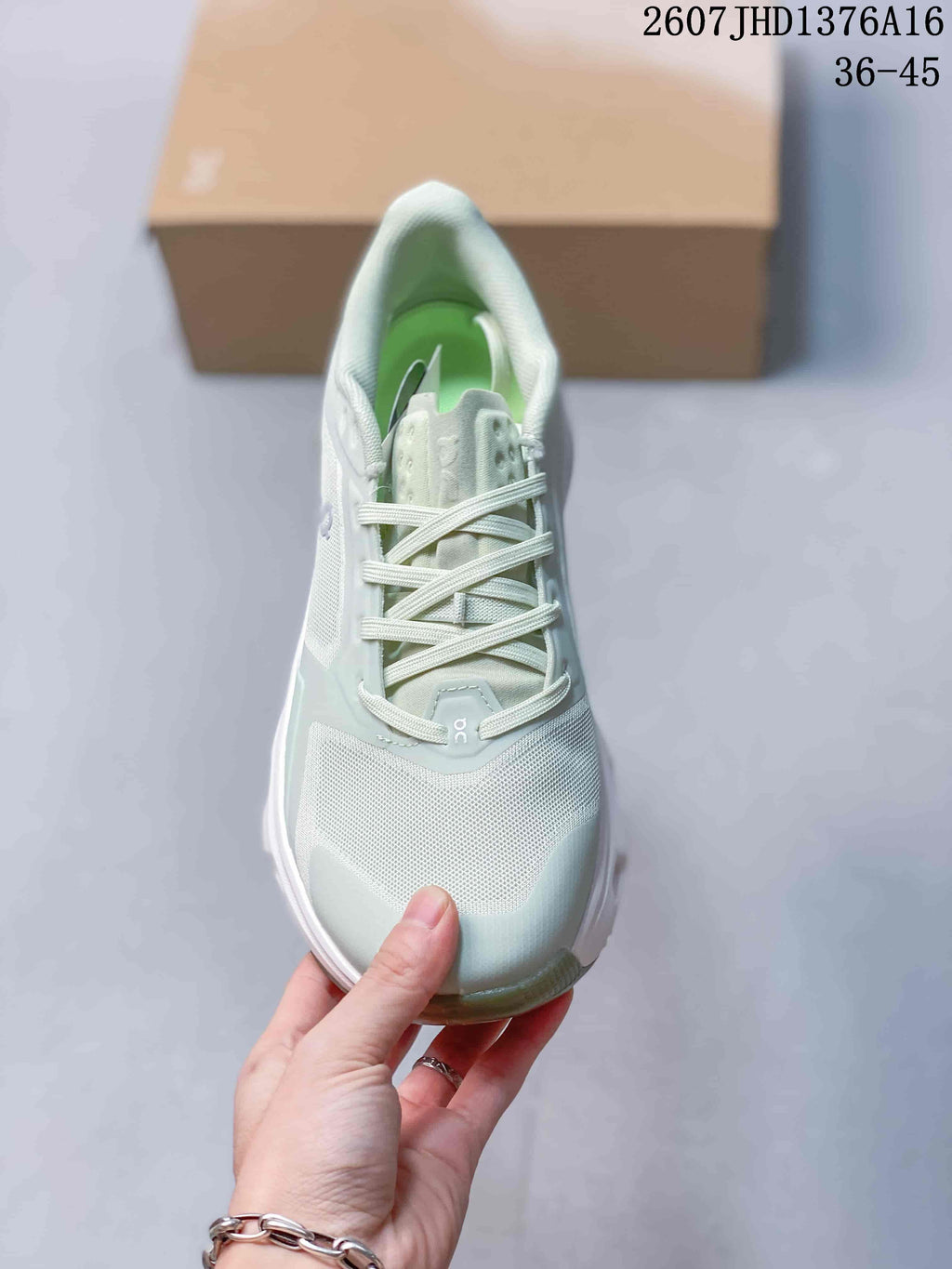 Top view of an On Cloudpulse 2 sneaker showing the mesh-style toe area, laces, padded tongue, and green interior.