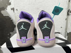 Rear view of pale pink basketball shoes with purple collars, dark heel panels, and mint-colored Jumpman-style marks.