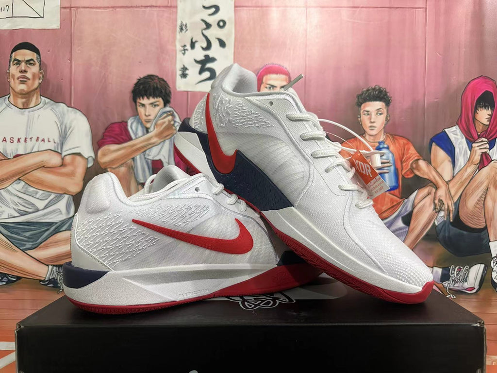 Pair of white Nike basketball shoes with red Swoosh accents, shown at an angle.