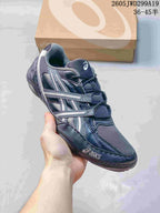 Side view of a dark navy ASICS GEL-1130 sneaker.