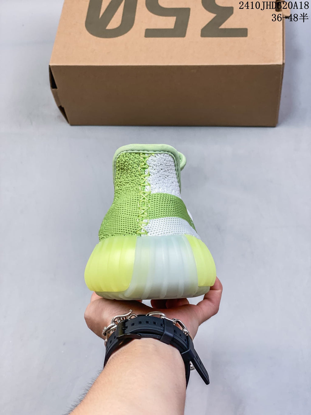 Rear view showing the padded collar, knit upper, and translucent outsole.