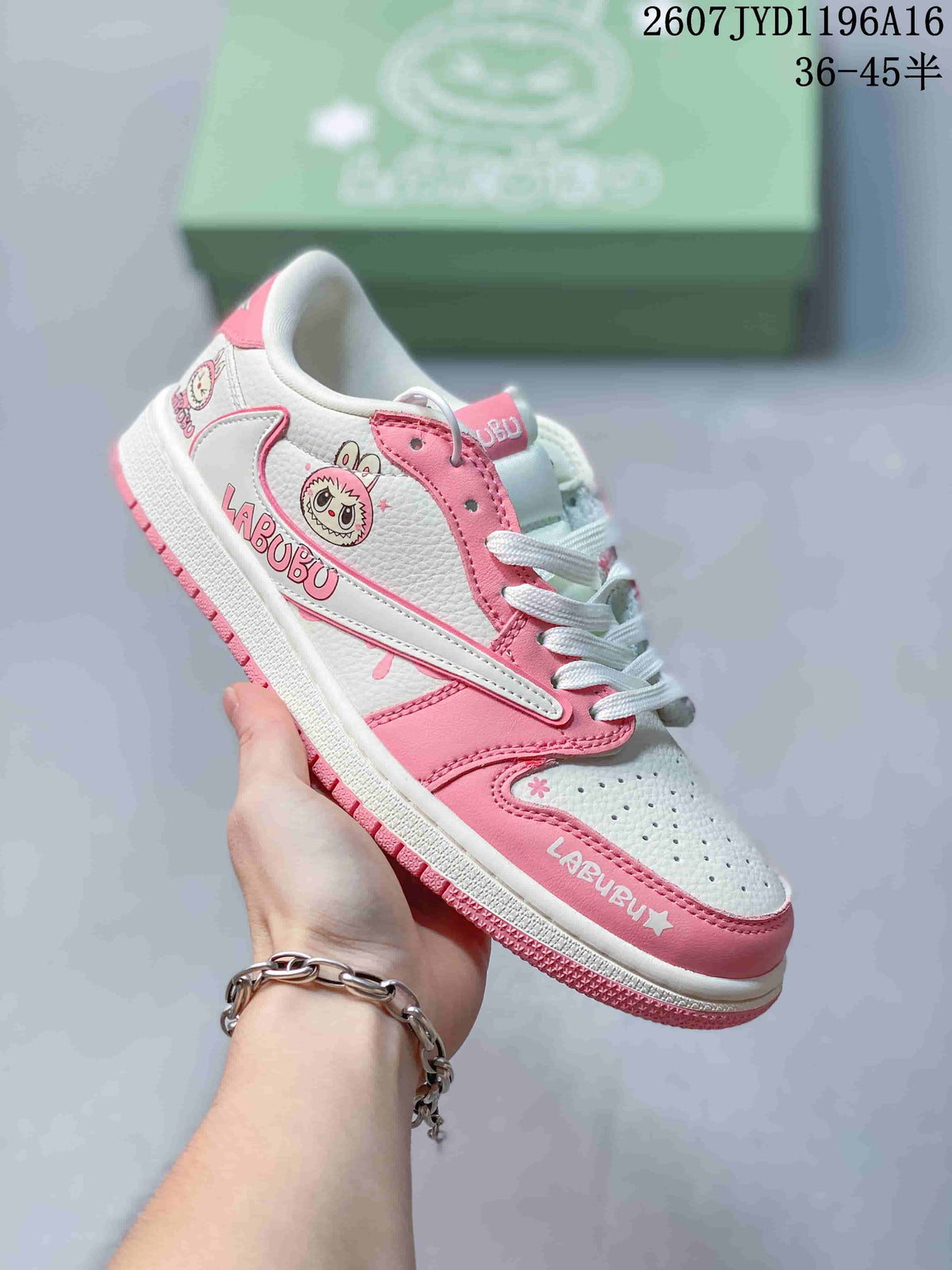Pink and white low-top Jordan sneaker with Labubu graphics, white laces and a pink outsole.