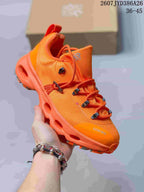 Angled close-up of an orange On LOEWE series sneaker showing the textured upper, lace hardware, heel pull tab, and sculpted sole.