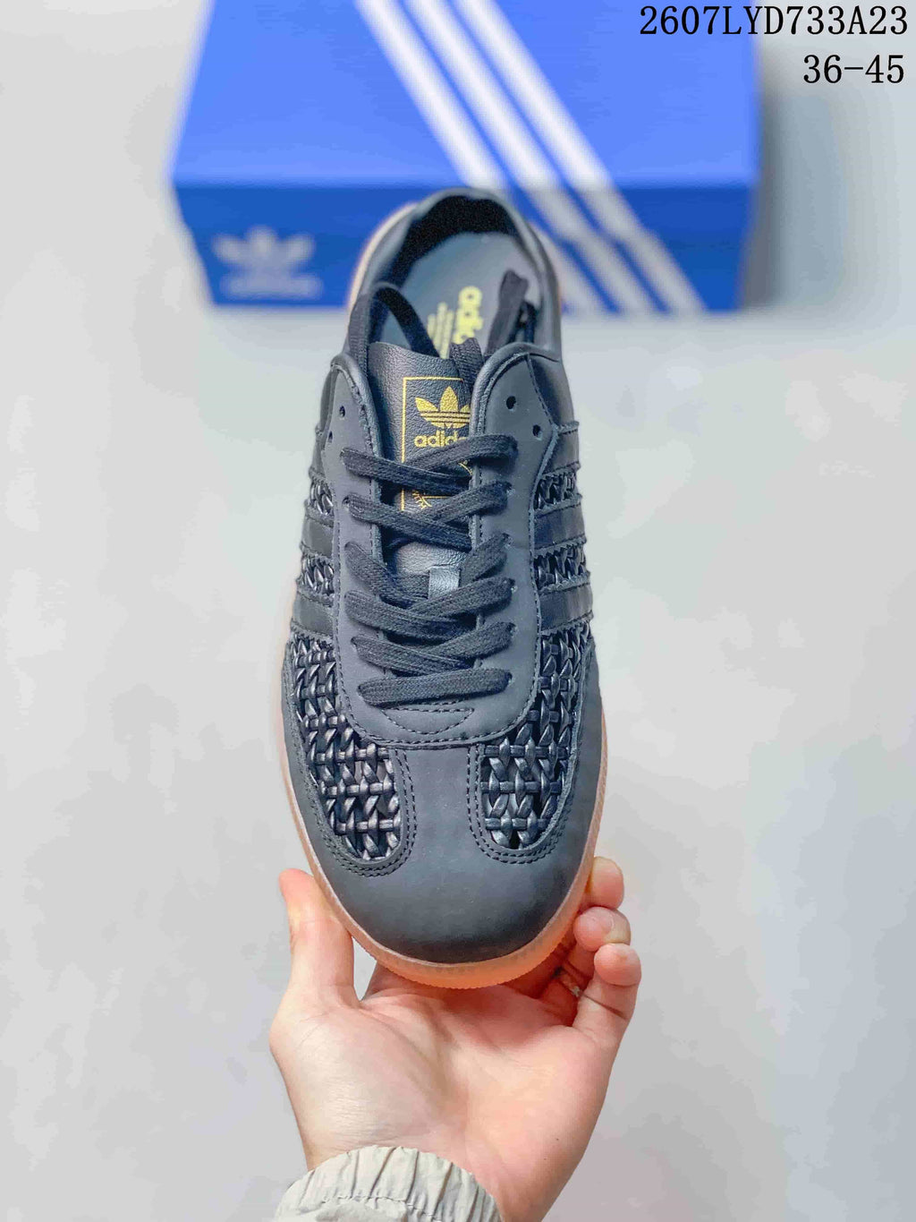 Top view showing the lace-up front, tongue branding, and woven toe panels