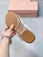 Close view of the textured gum-colored outsole with an embossed Miu Miu logo.