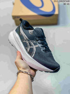 Three-quarter side view of a navy and white ASICS sneaker showing the textured upper, side branding, white midsole, and FF BLAST+ marking.