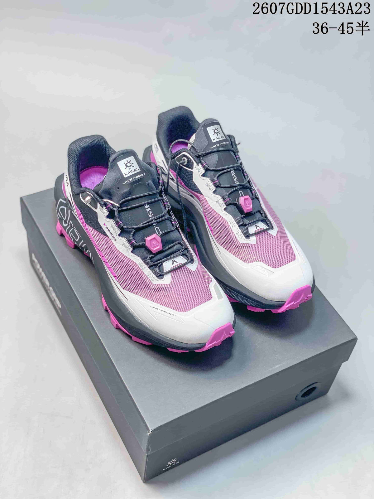 Pair of KAILAS FUGA EX PRO trail running shoes in pink, black, and white displayed on a shoebox; the image shows style code 2607GDD1543A23 and size range 36–45.