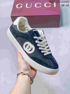 Side view of a blue Gucci G75 sneaker showing mesh panels, suede-look overlays and a circular Double G emblem.