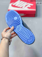 Close-up of the blue rubber outsole showing its circular traction pattern and branding.
