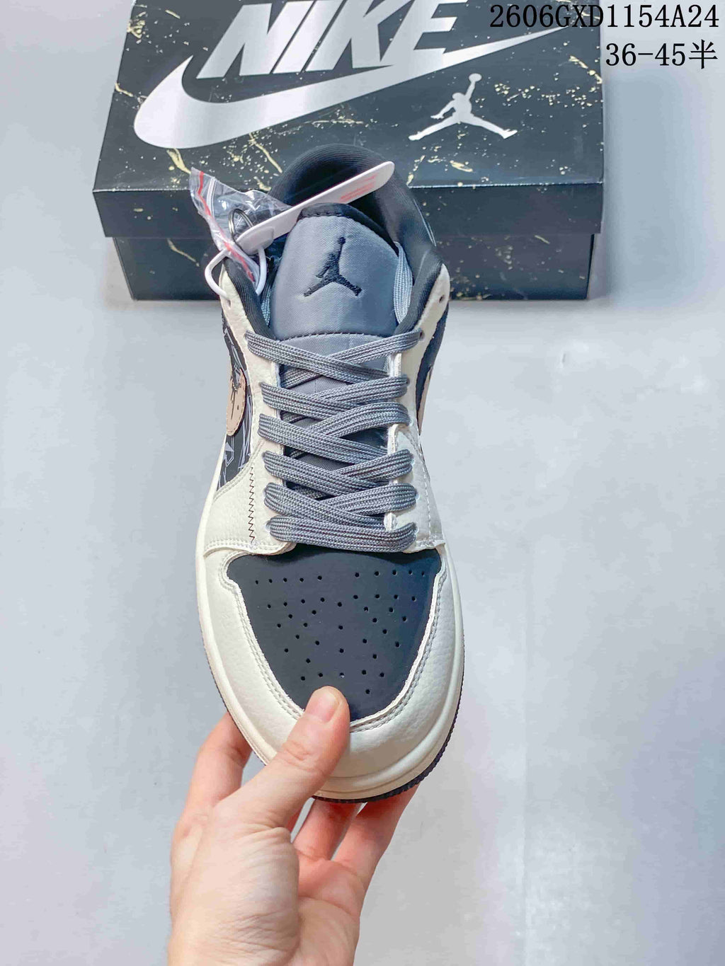 Front view showing perforated toe panel and gray laces